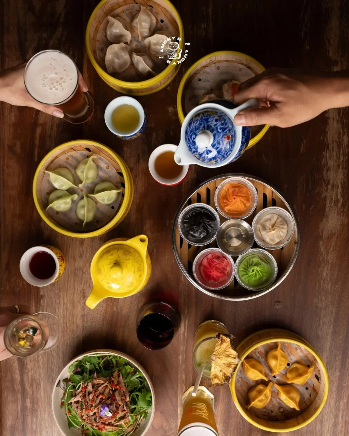 A spread of handmade dumplings in bamboo steamers