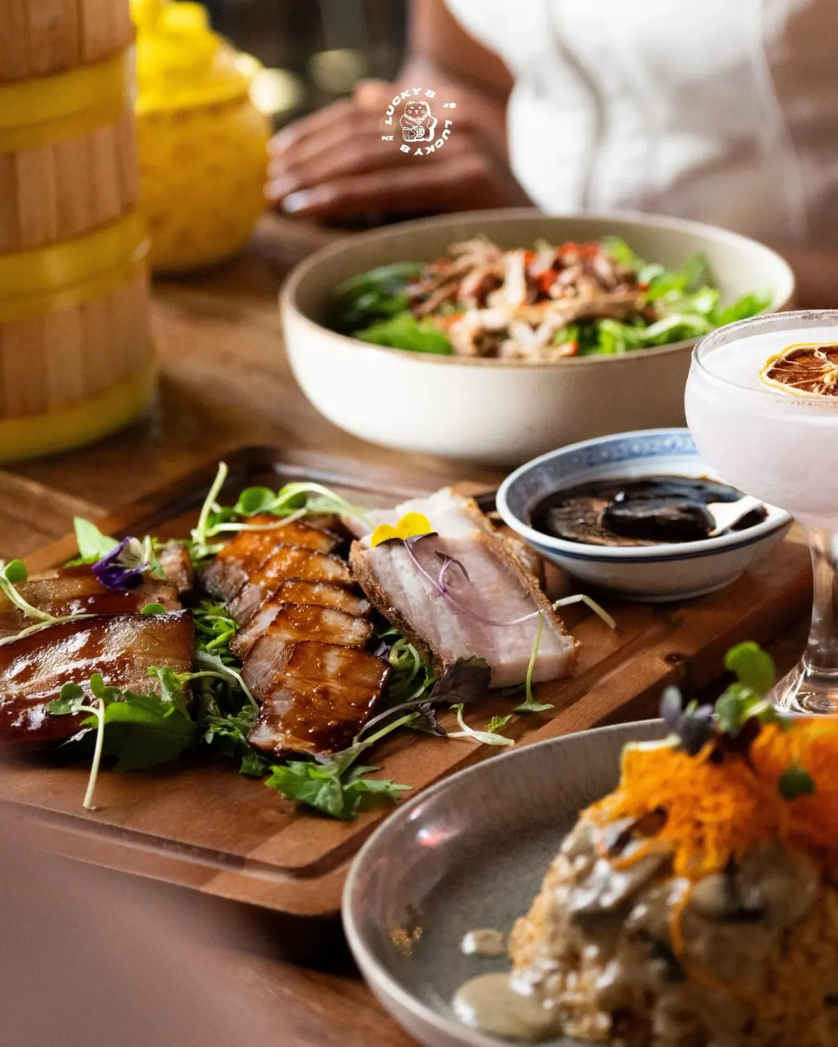 Duck salad and duck fried rice served alongside the shared plates